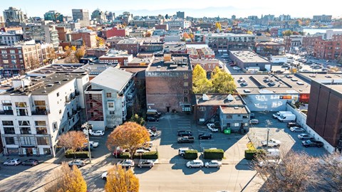 A cityscape with buildings and cars.