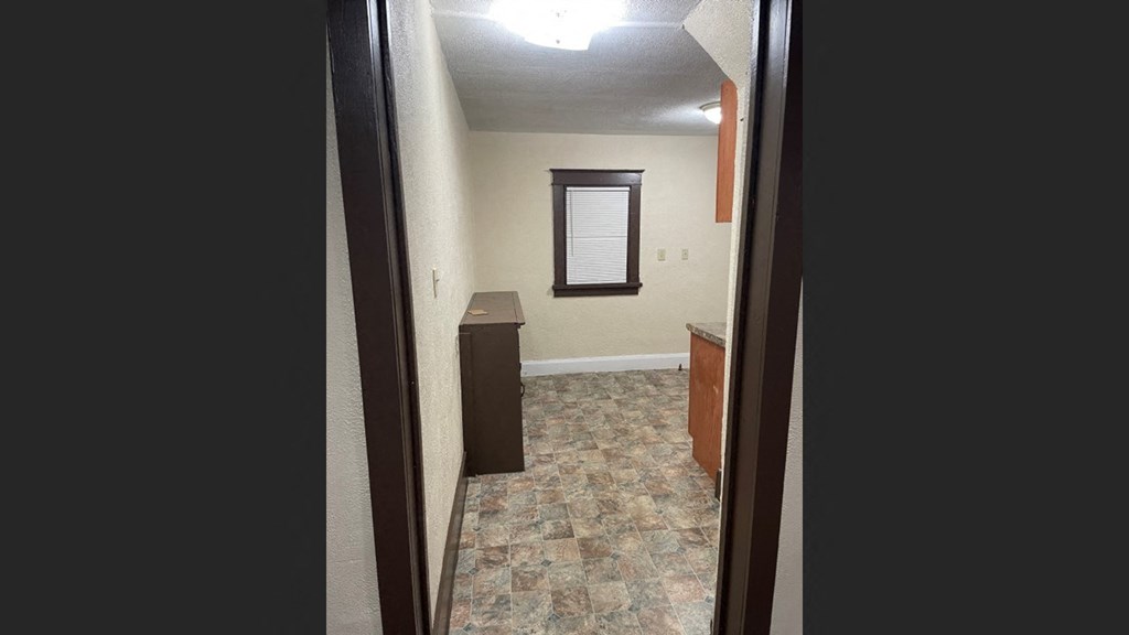 a room with a sink and a window in it