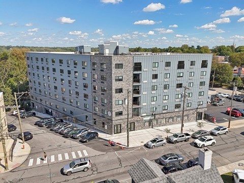 A large building with a parking lot in front of it.