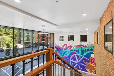 A mural of a bridge painted on a wall.