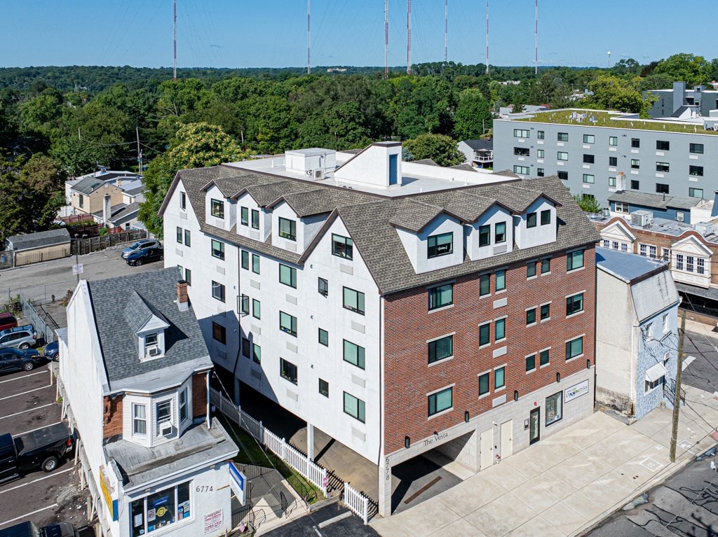 a view of a building from the roof of another building