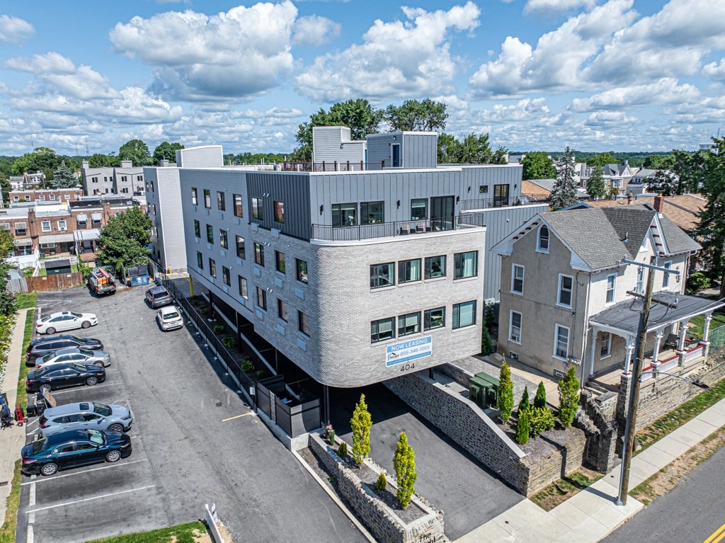 an aerial view of a modern building in a city