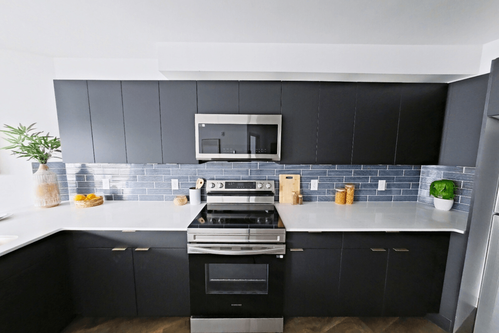 A modern kitchen with a black and white color scheme.