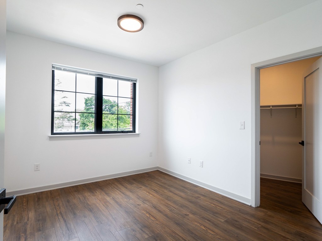 A room with a window and a door.