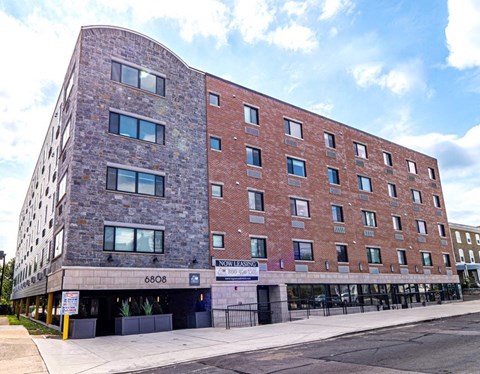 a large brick building on the side of a street