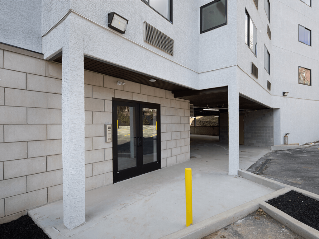 the entrance to a building with a glass door