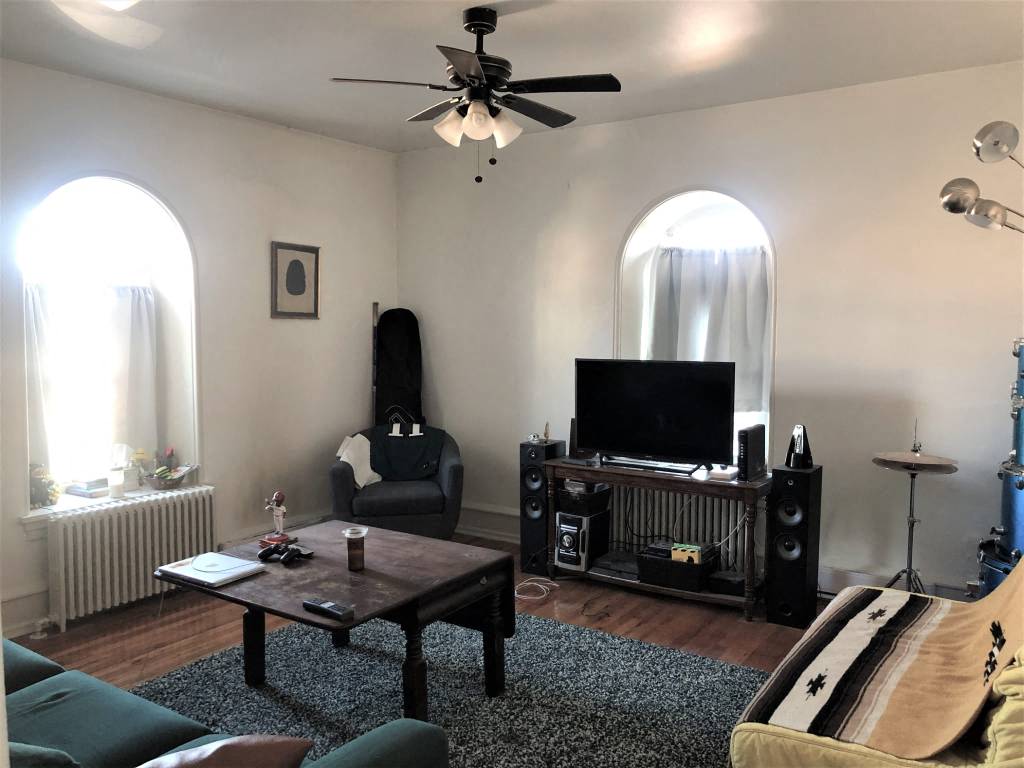 a living room with a couch and a television