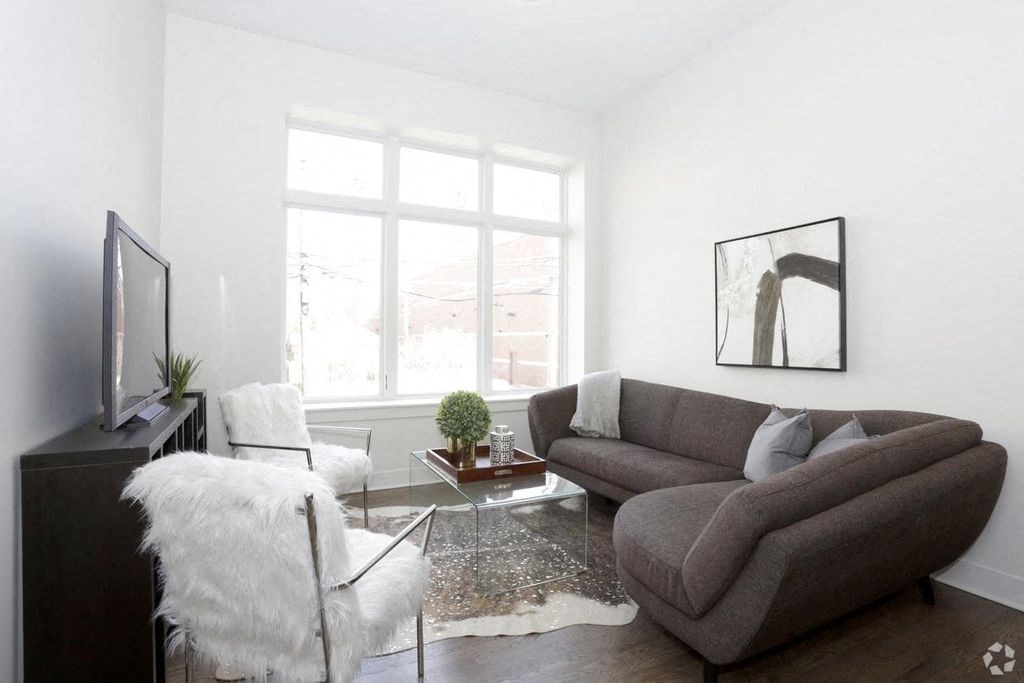 a living room with a couch and a chair