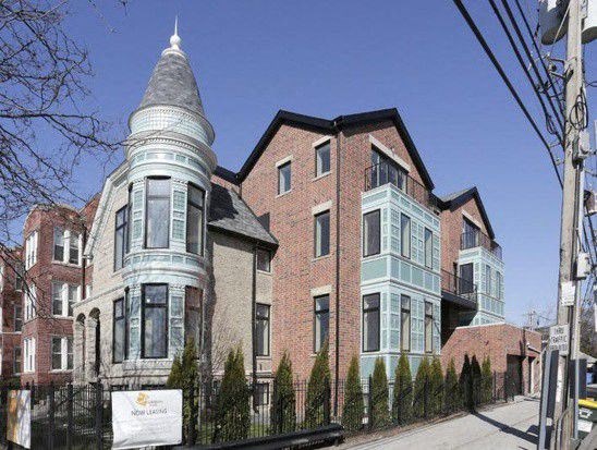 a large brick house with a turret on top of it