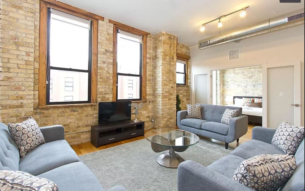 a living room with a couch and a tv