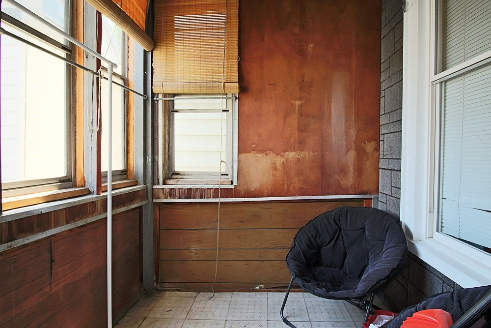 a room with a chair and a window in it