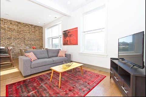 a living room with a couch and a television