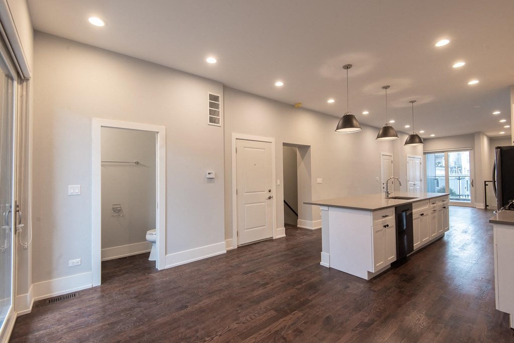 the kitchen and living room in a new home