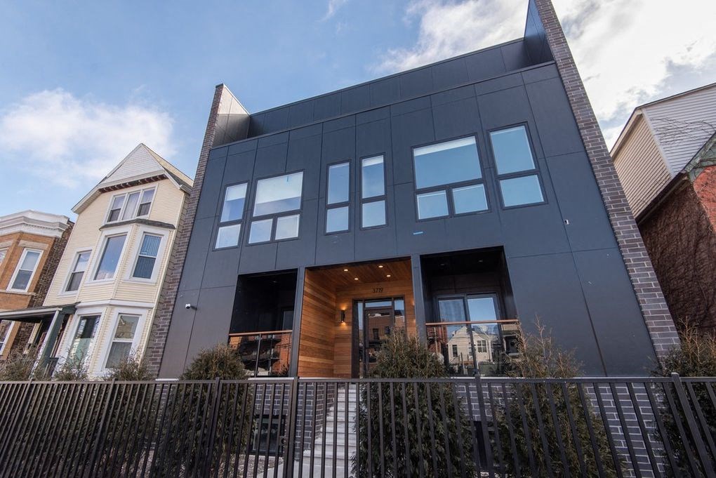 a building with a fence in front of it