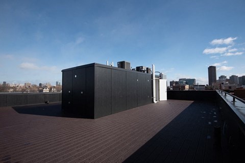 the view of the city from the roof of a building