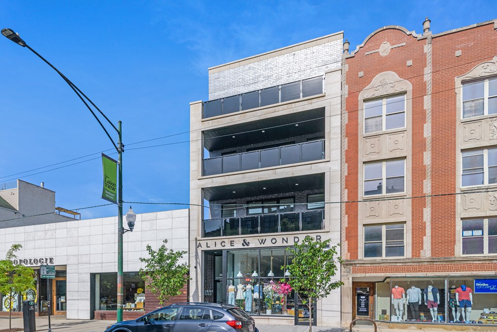 a building with a store on the corner of a city street