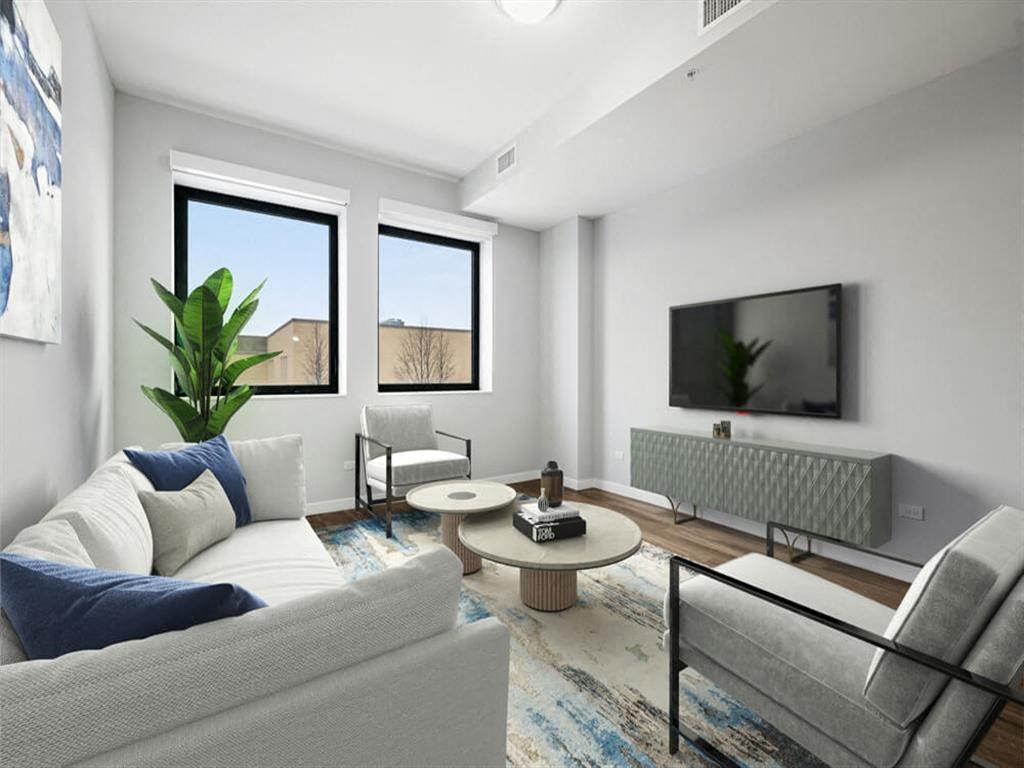 a living room with a couch and a tv