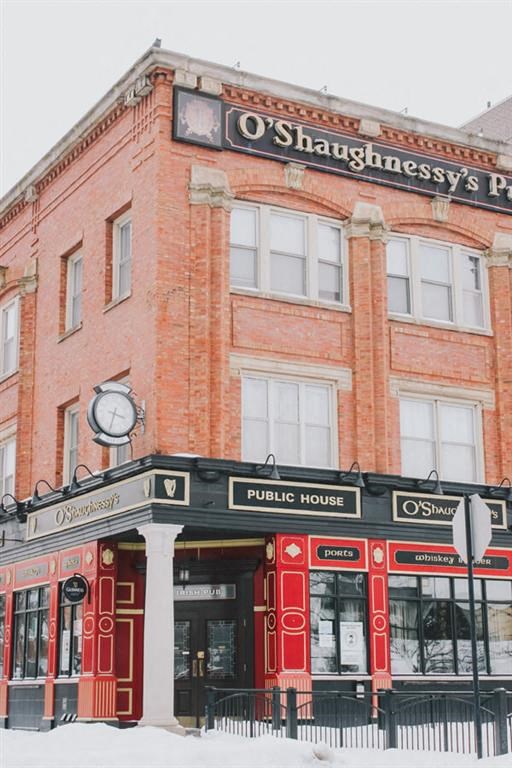 a red brick building with a clock on top of it