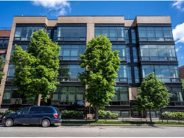 a blue van parked in front of a building