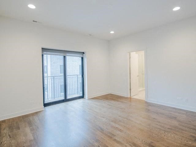 an empty living room with a sliding glass door