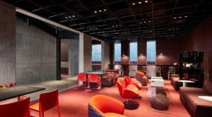 a large room with chairs and tables and a lobby