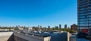the view of the city from the roof of a building