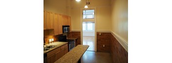 an alternate view of the kitchen and living room