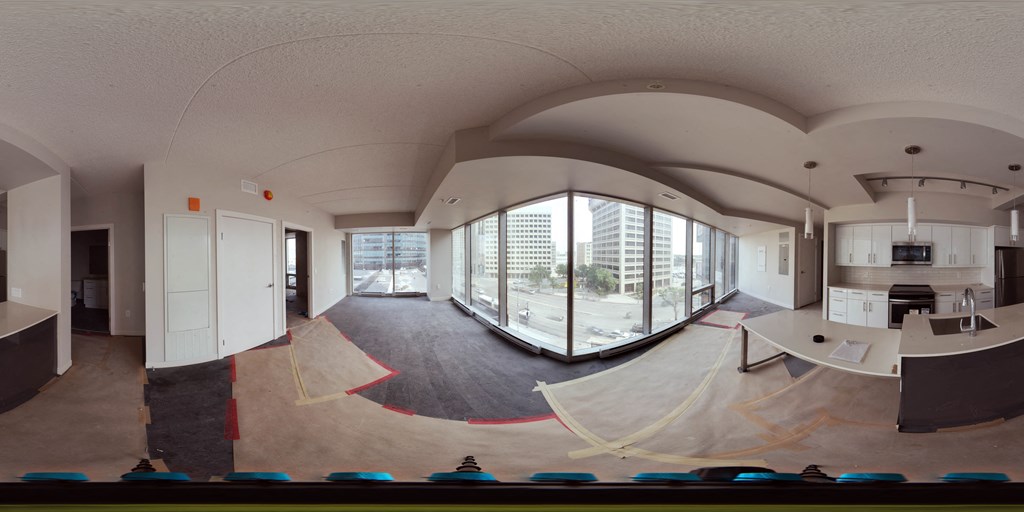 a large room with a skateboard room and a large window