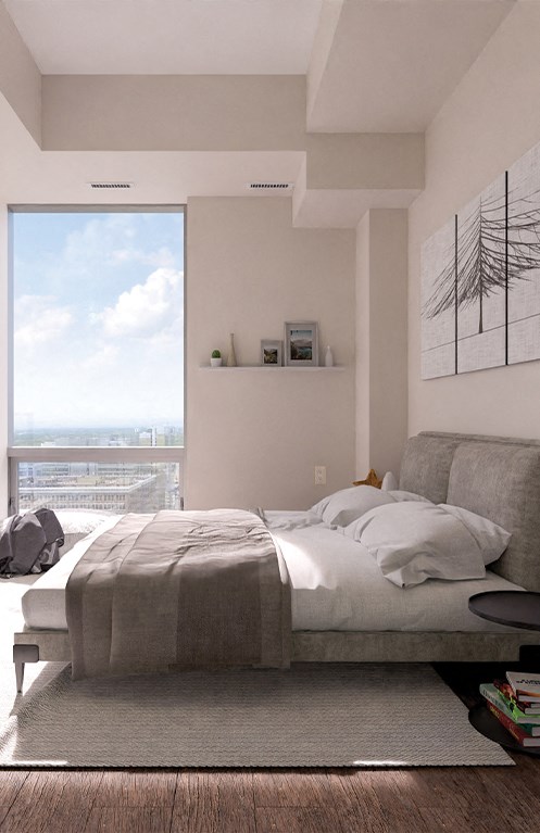 a bedroom with a bed and a large window