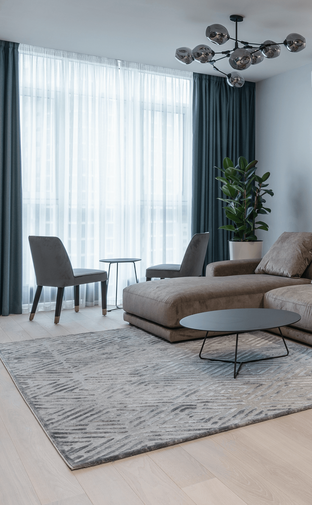 a living room with a couch and two chairs