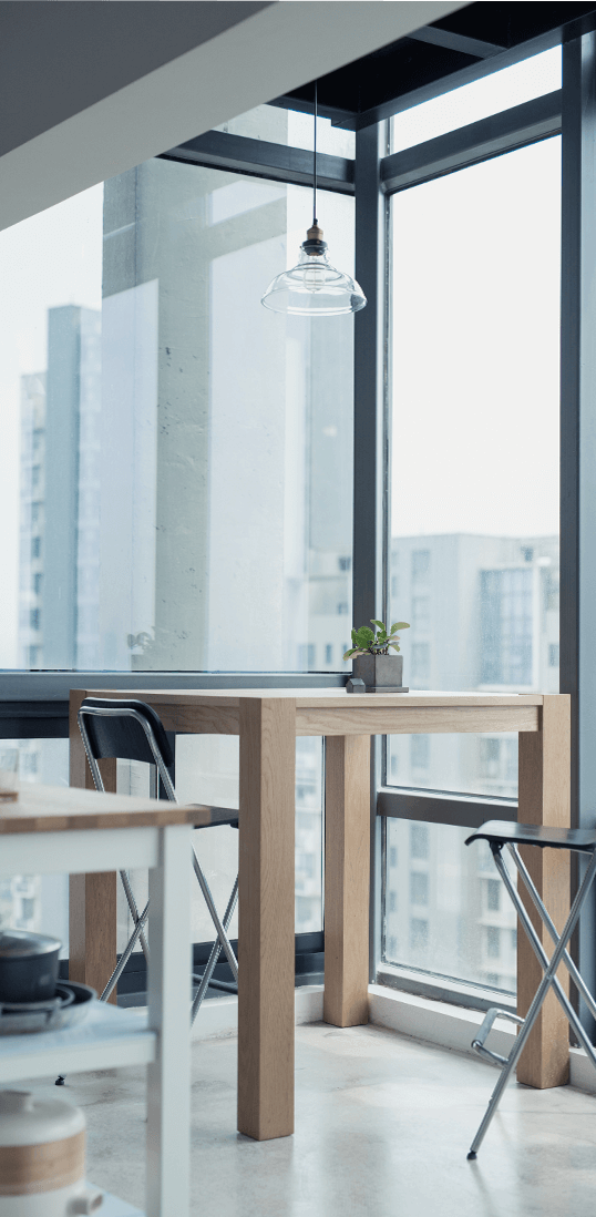 a table in an office with a potted plant on top of it