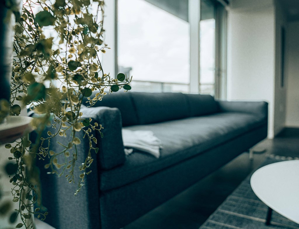 a living room with a couch and a table