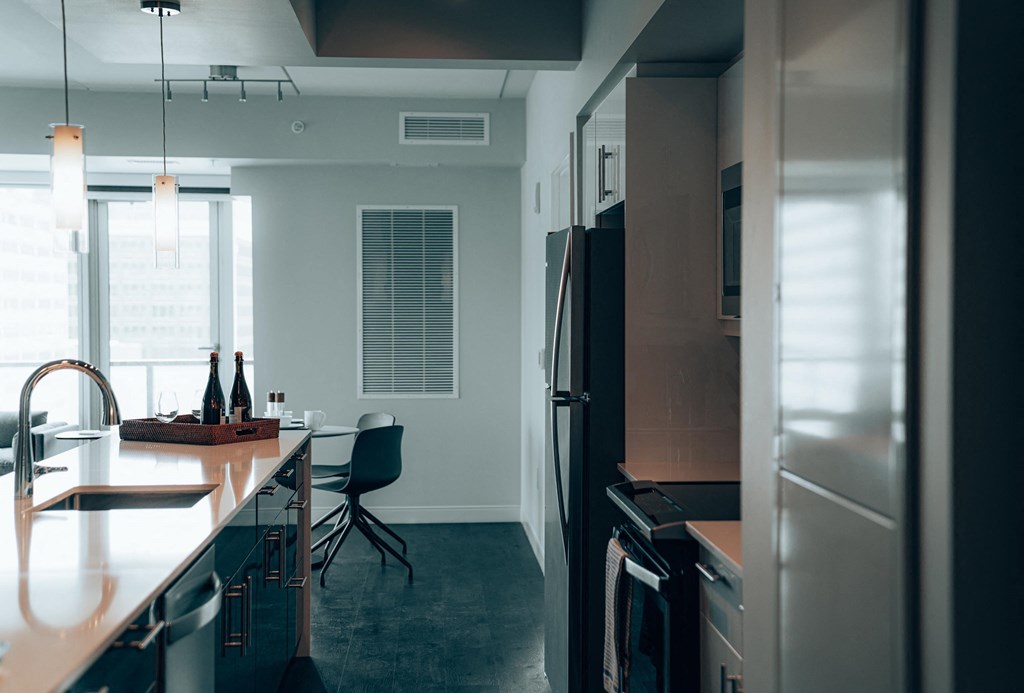 a kitchen and dining area in a 555 waverly unit