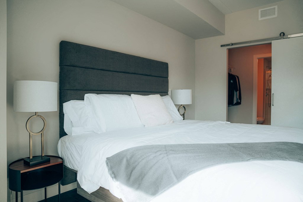 a bedroom with a bed and a nightstand