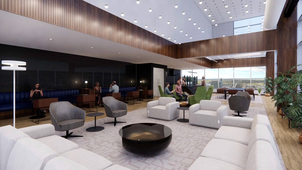 a lobby of a hotel with couches and chairs