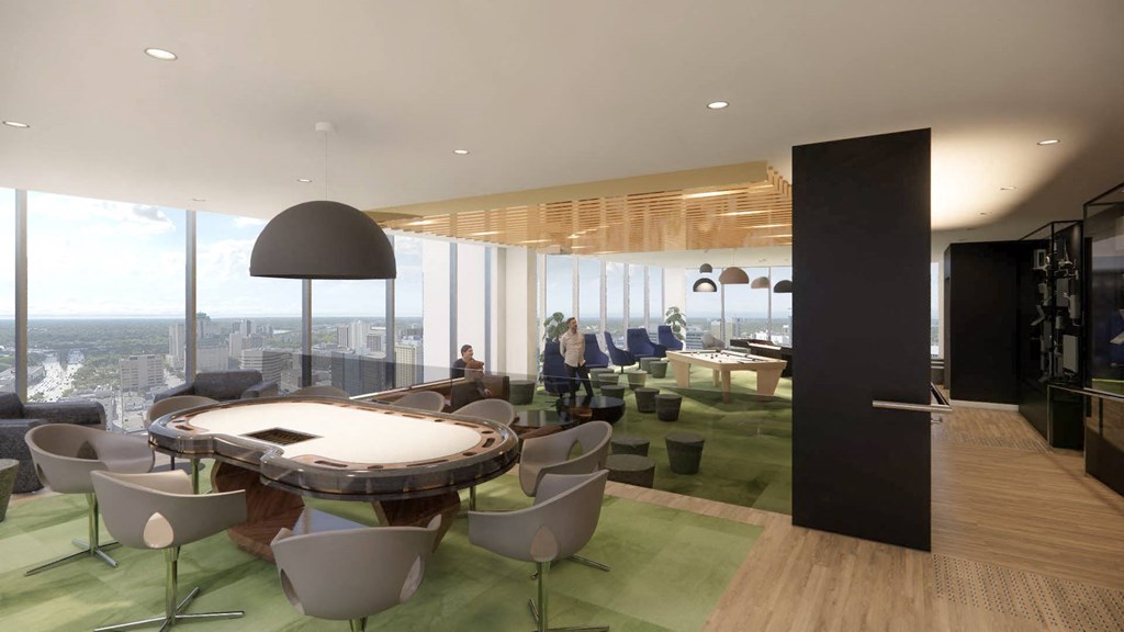 a conference room in a skyscraper with a large table and chairs