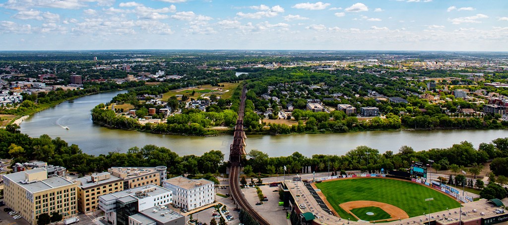 an aerial view of a city with a river