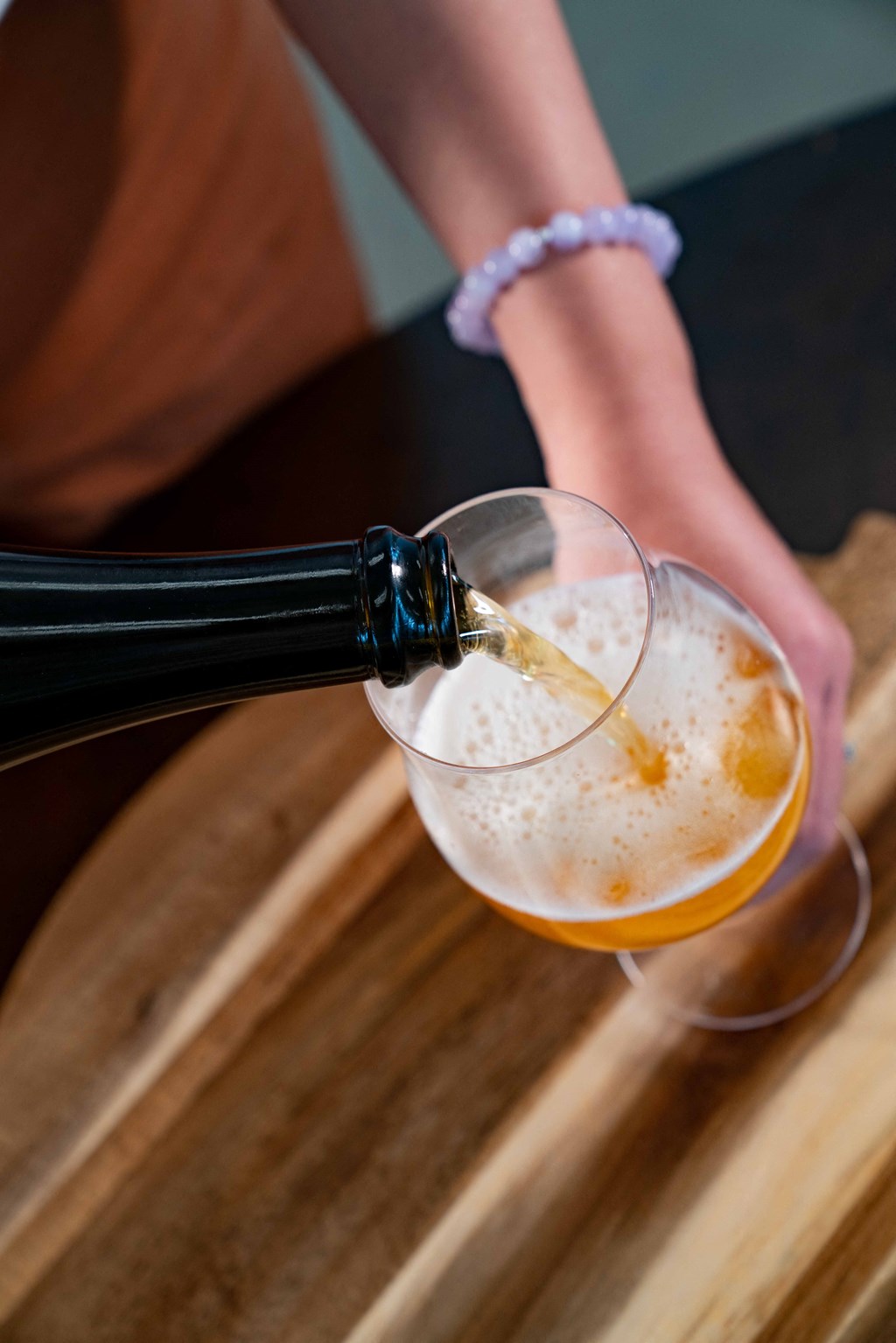 pouring beer into a glass