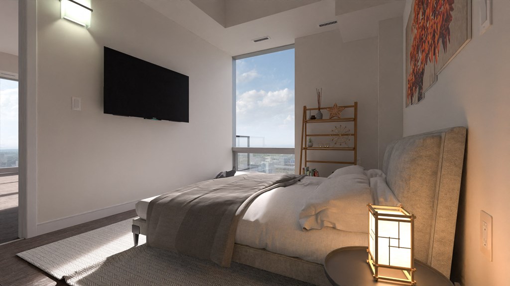 a bedroom with a large bed in front of a window