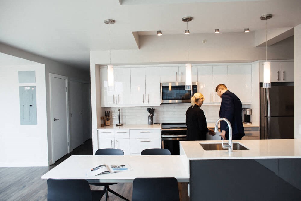 two people in a kitchen