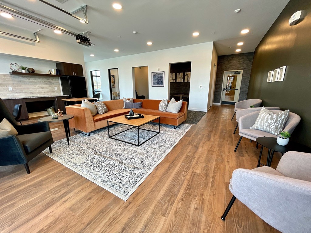 A living room with a fireplace and a television.