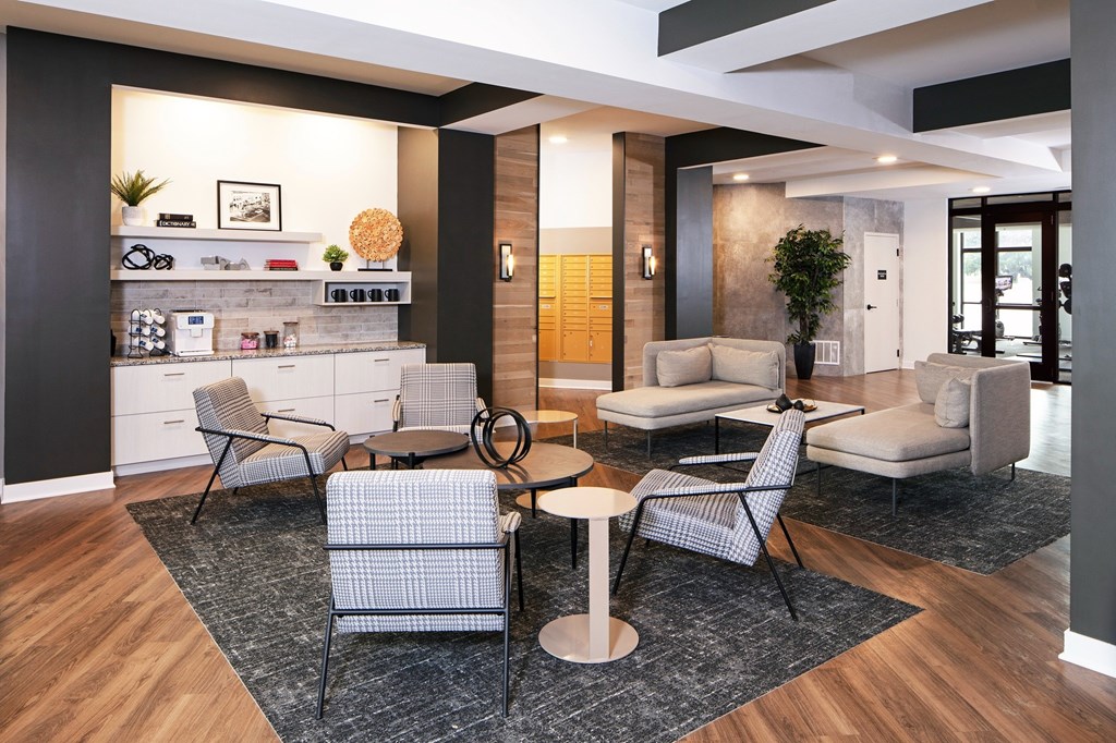 A modern living room with a grey and white chair set.