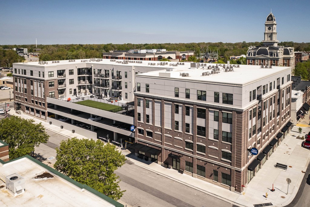 an aerial view of a city with buildings and a clock tower