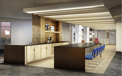 A modern office space with a reception desk and seating area.