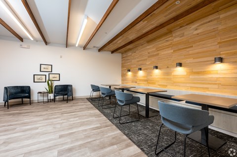 A conference room with a long table and chairs.