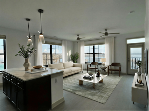 A modern living room with a large window and a balcony.