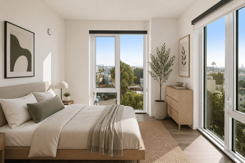 A bedroom with a large bed and a view of the city.