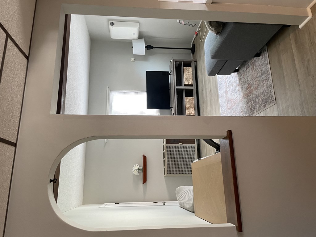 a view of a bathroom from above and a picture of a bed and a sink