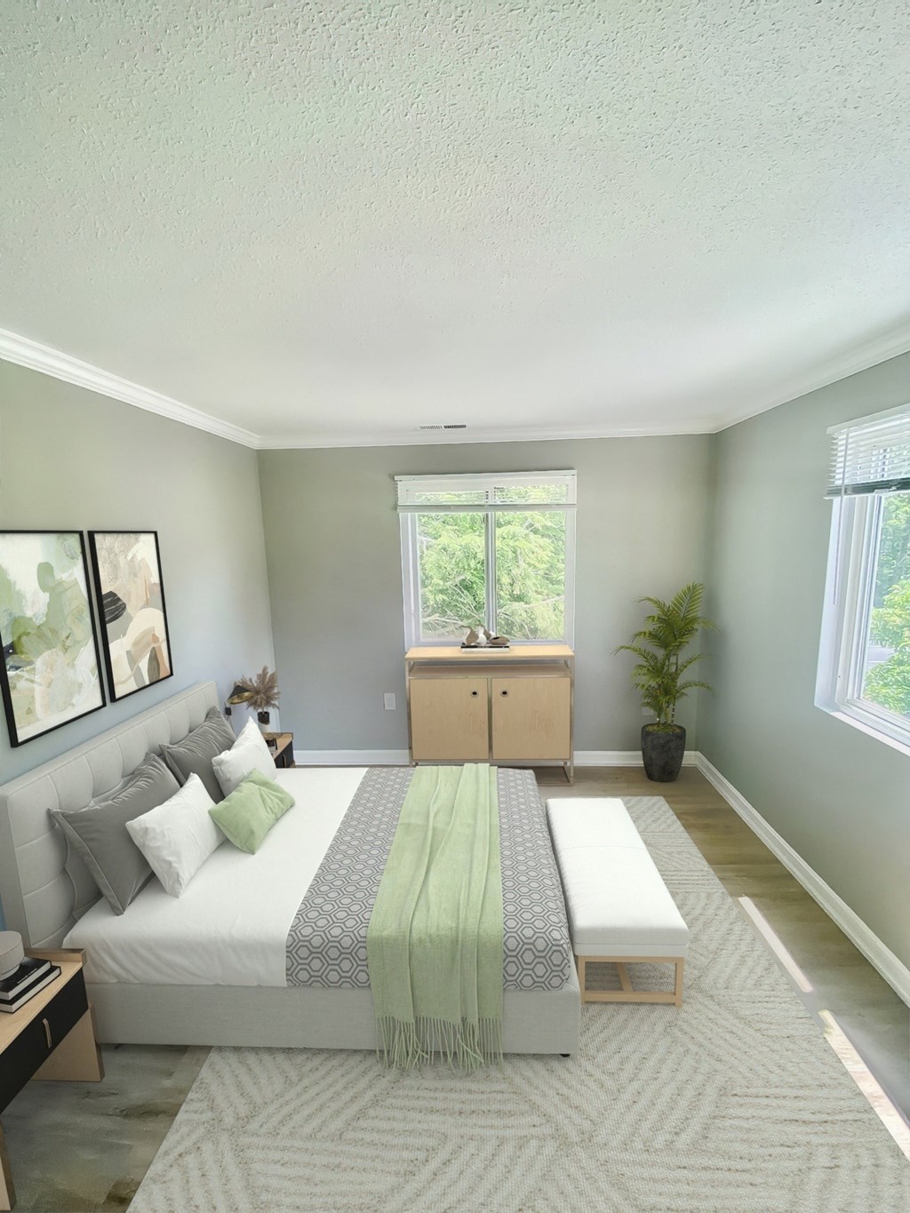 a bedroom with a bed and a couch and a window