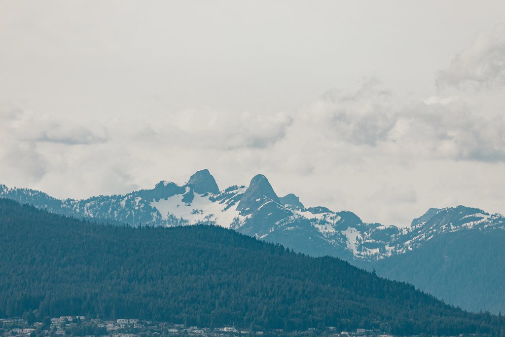a view of the mountains in the clouds